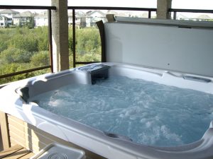 hot tub on upper deck, with doors to both master and en-suite bathroom